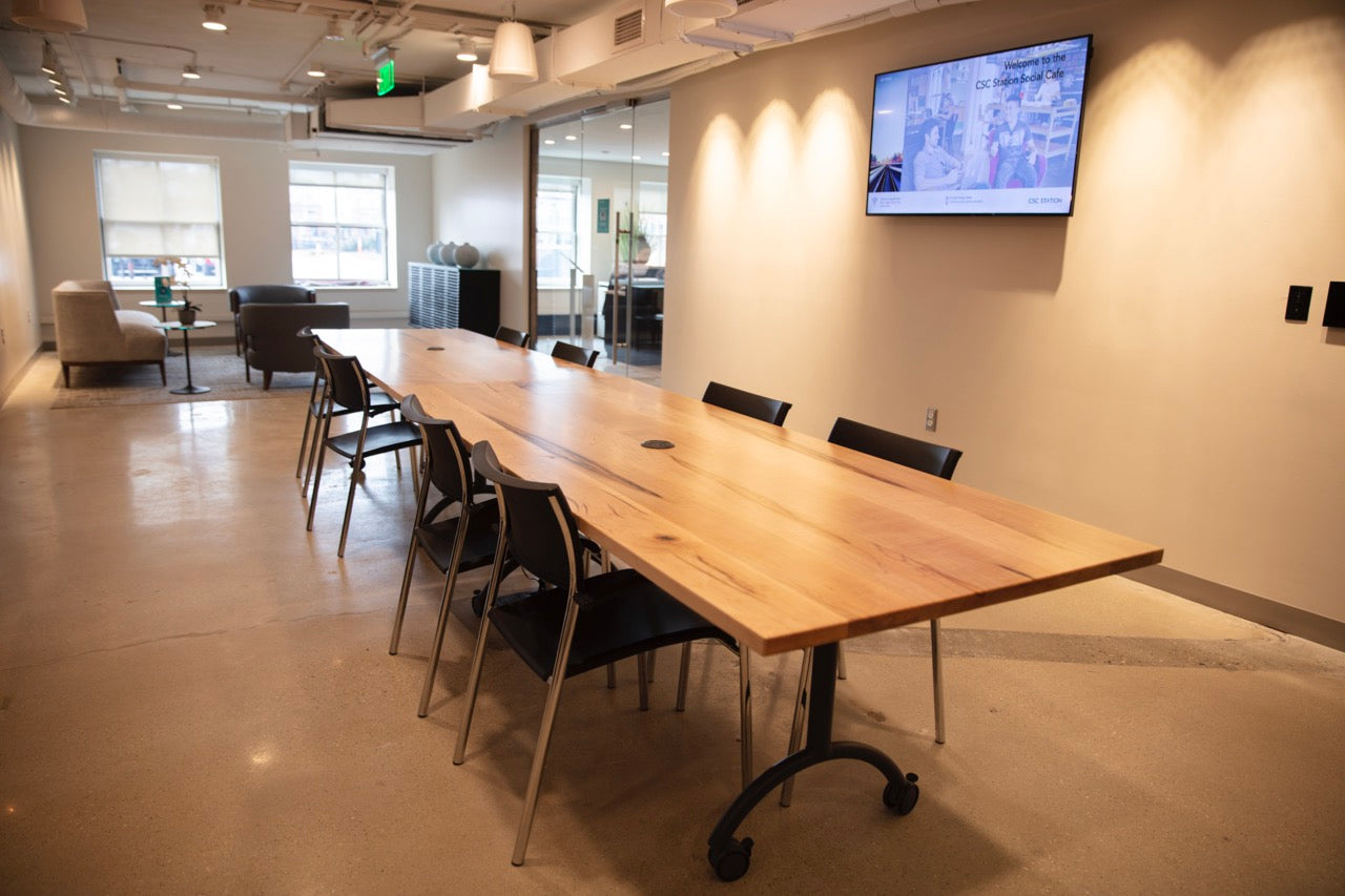 Light wood conference table with casters