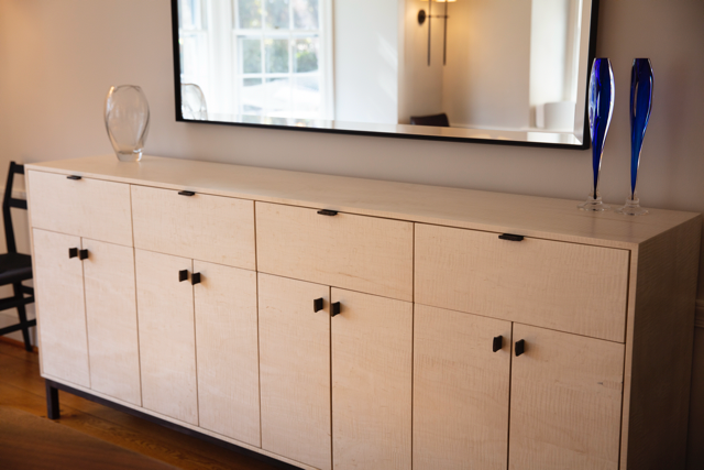 Light colored credenza with ample storage cabinets