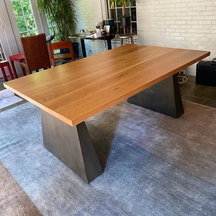 Desk with wooden top and stone legs in office