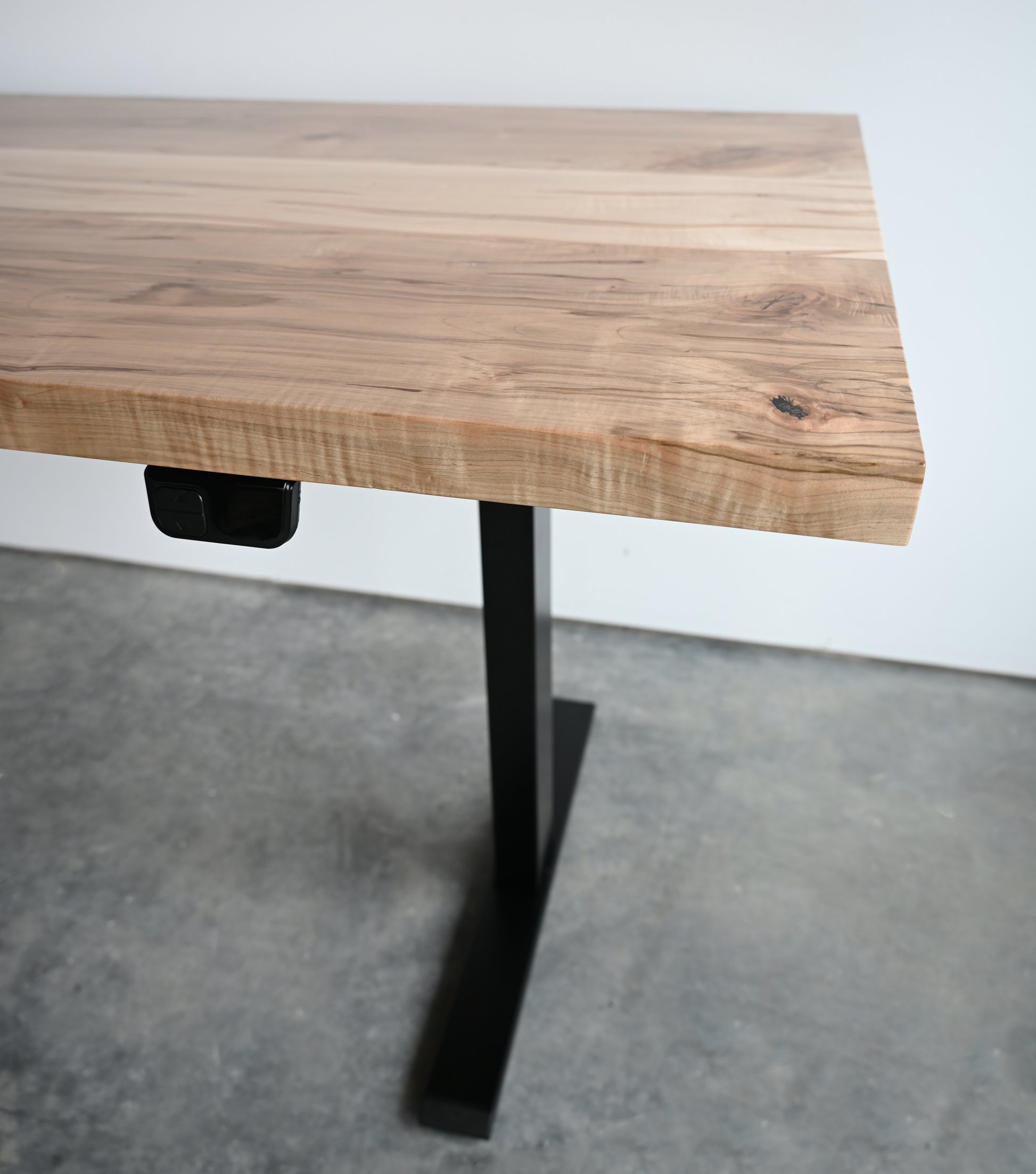 Close up view of wooden top on standing desk