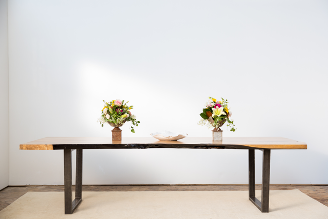 Dining table with wooden top and metal legs