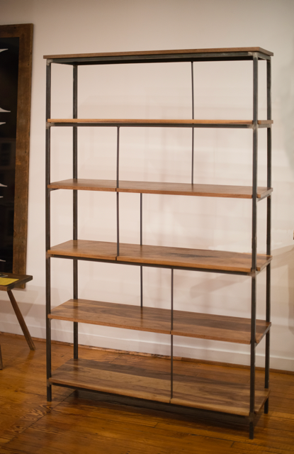 Tall wooden shelving until with metal sides