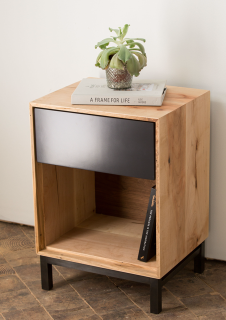 Wooden end table with black drawer and metal base